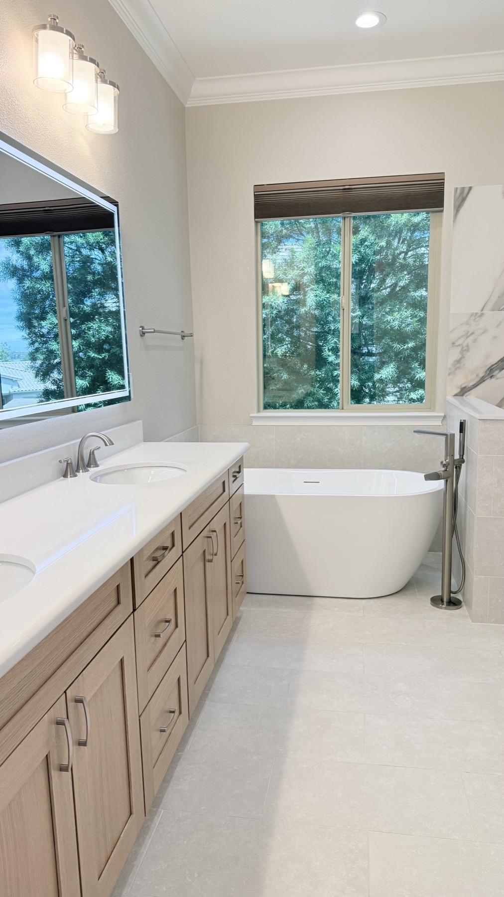 Completed primary bathroom remodel with freestanding tub and double vanity in El Dorado Hills California