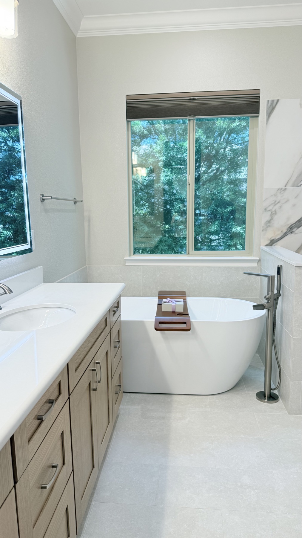 Freestanding bathtub with floor-mounted filler after bathroom remodeling in El Dorado Hills