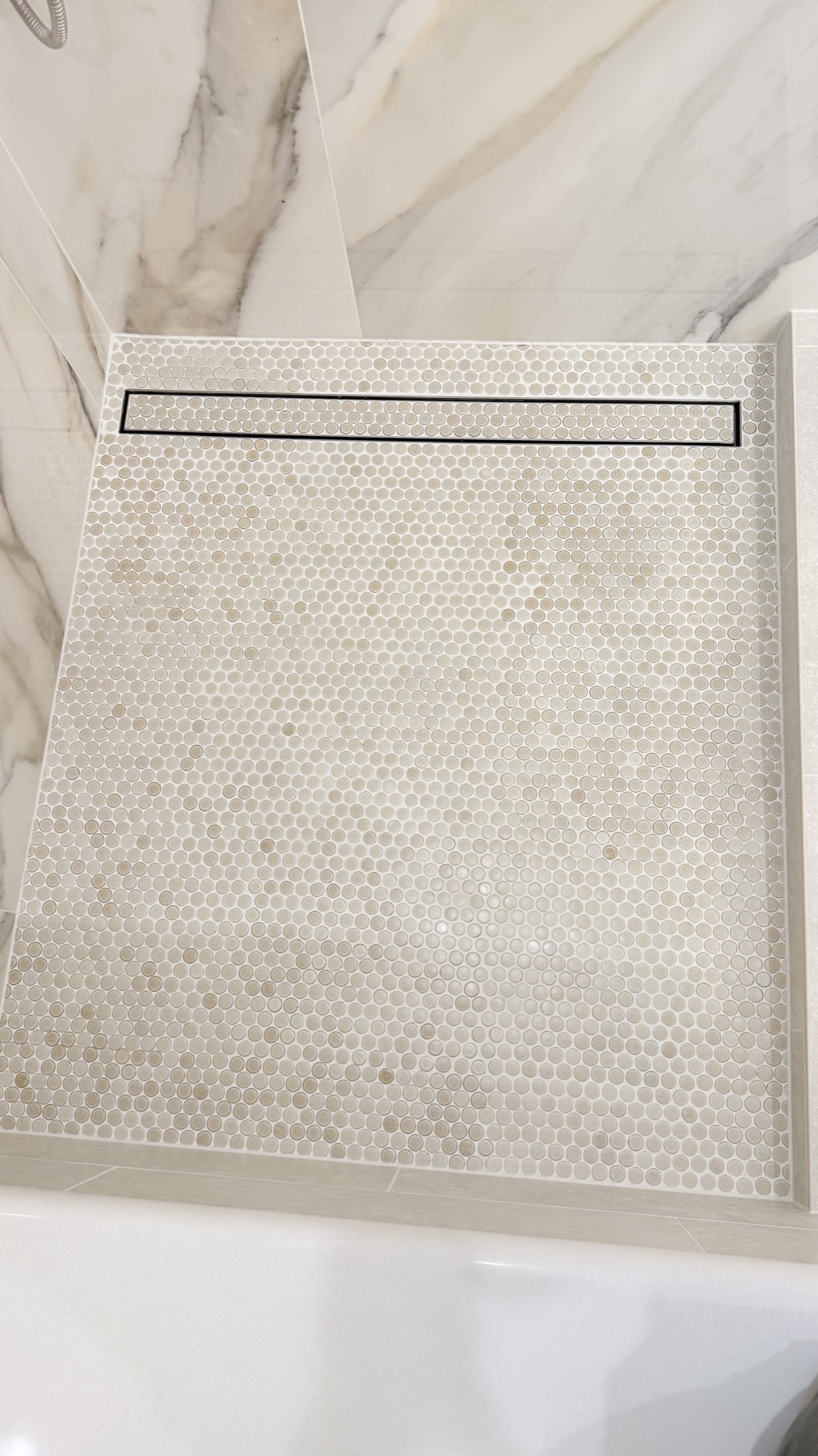 Mosaic shower floor and linear drain in a remodeled El Dorado Hills bathroom
