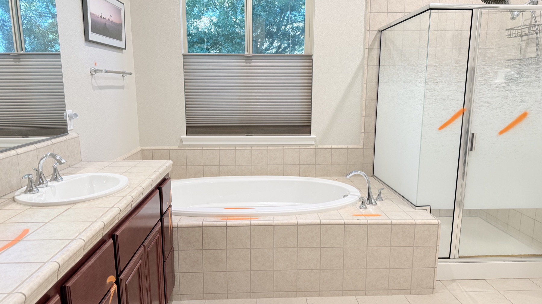 Original built-in bathtub and small corner shower before an El Dorado Hills bathroom remodel