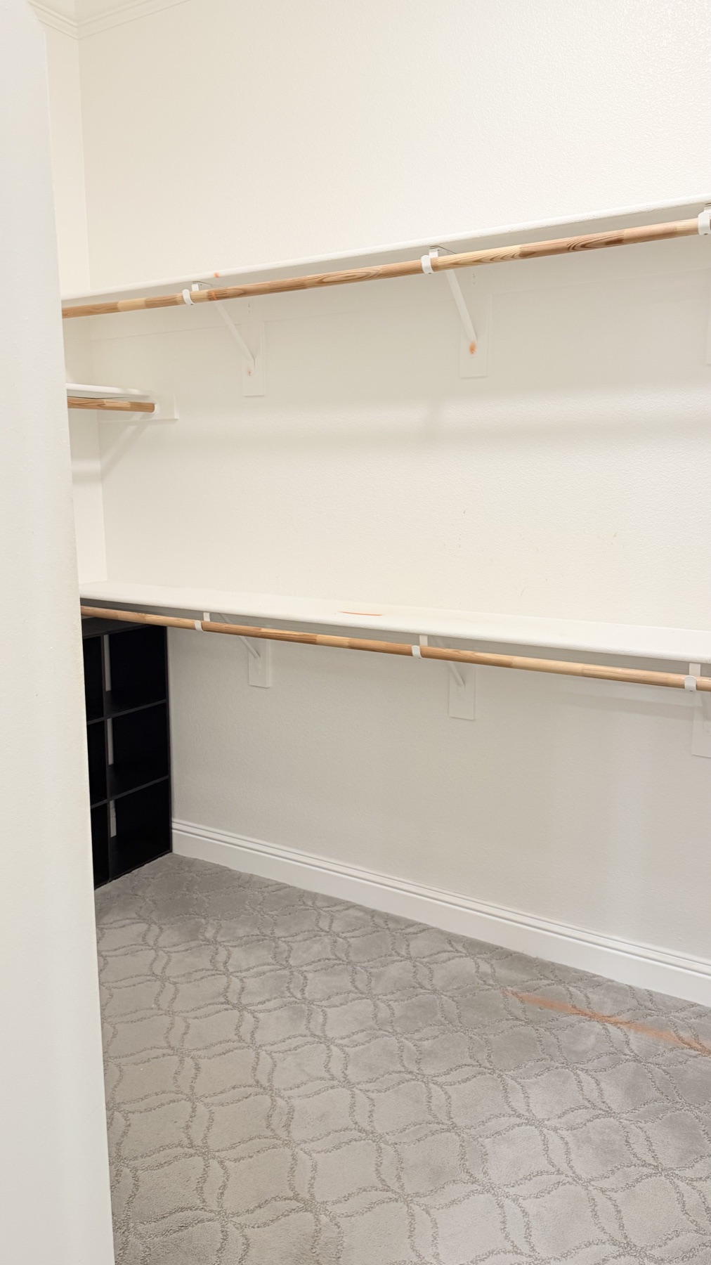 Walk-in closet before custom storage installation in El Dorado Hills