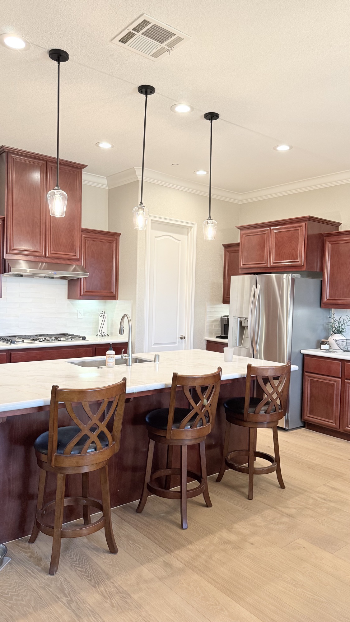 New light countertops paired with existing cherry cabinets in El Dorado Hills