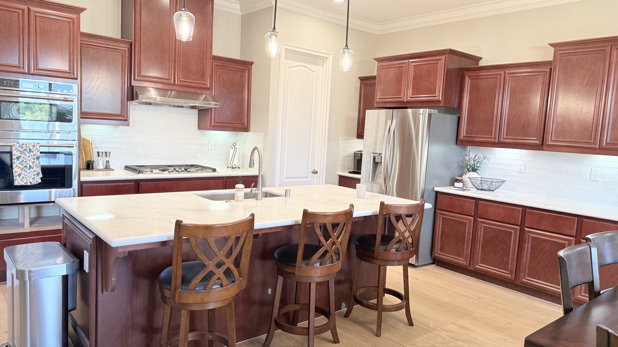 Completed El Dorado Hills kitchen remodel with light countertops and preserved cherry cabinets